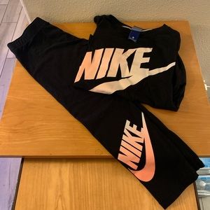 Nike pants and shirt both are cotton not the silky stuff.